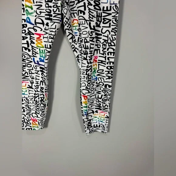 NWOT ATHLETA ELATION TRAIN 7/8
Tight Leggings PRIDE Graffiti words L - Picture 10 of 13